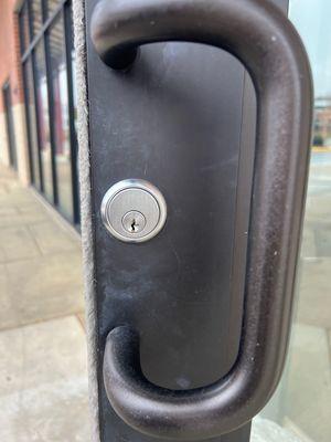 front view of lock on  commercial glass door