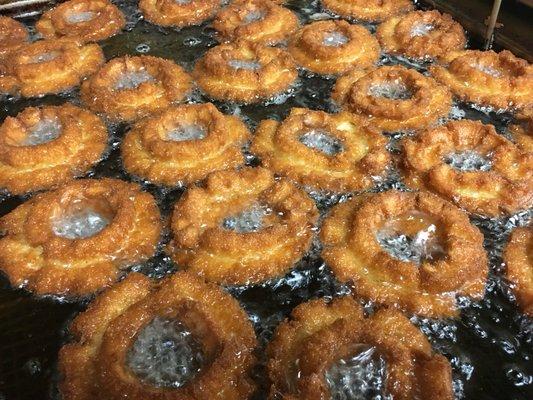 Old Fashion donuts in the fryer.