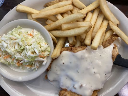 Chicken fried chicken with fries and coleslaw