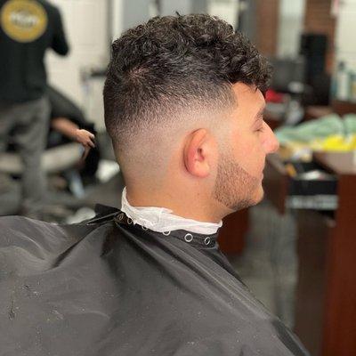 Skin tight fade with beard lineup.