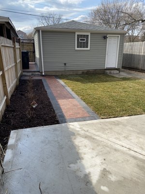 The concrete seen is new, the walkway and between garages is new, sod is new