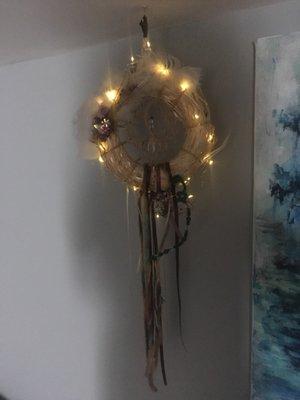 I found this beautiful dream catcher here at a super reasonable price. I love the hand made look. . (I added the fairy lights.)