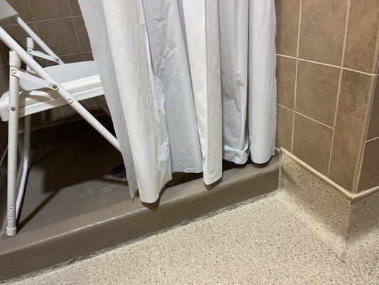 Shower curtain way to short!!! Water would have poured all over the floor if shower was used--CREATING A MAJOR SLIP/FALL HAZARD