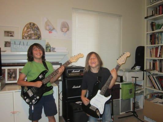 Logan and Marek having a lot of fun playing guitar!