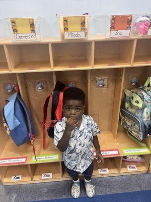 My son in front of his cubby on 1st day of school