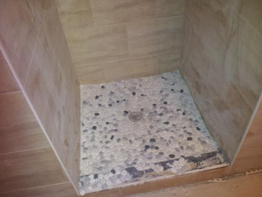 Installed new drain .. made custom shower pan and installed all tile...