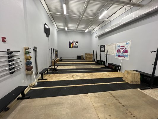 Olympic Weightlifting gym.  Equipment Barbells, Bumper Places, and Platforms for athletes to learn the Snatch and Clean and Jerk