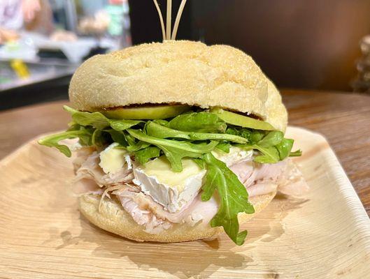 Off-the-breast sliced turkey, brie, green apple, arugula, and fig jam.