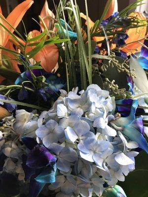 Orchids and hydrangeas for a blue themed reception