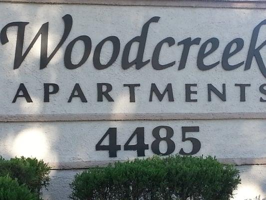 Woodcreek apartment sign