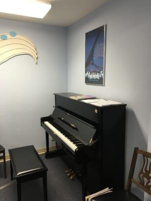 U1 Yamaha upright piano in one of the classrooms