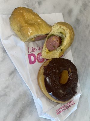 Large sausage cheese & jalapeño kolache. Chocolate glazed donut.