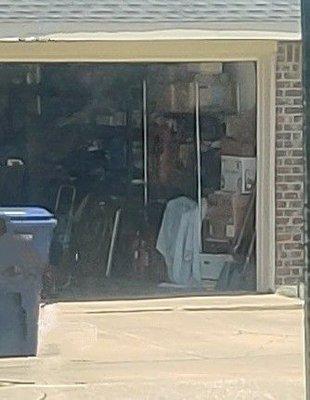 Homeowners both arrive to find garage door wide open and unattended for an extended amount of time.