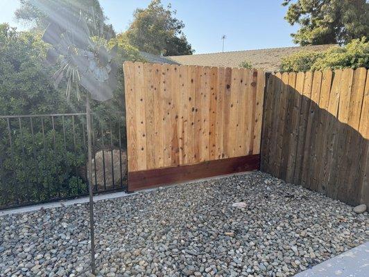 Wrought iron fencing with wood section