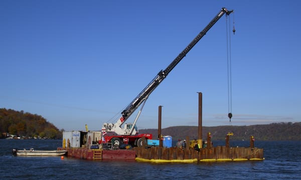 Crane and Flexifloat Barge building new intake and outfall structures. (2010)