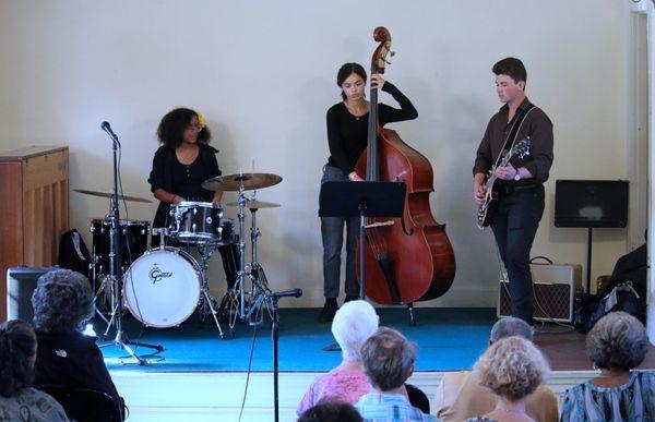 Nora Hylton Trio with Nora Hylton on bass, Jacob Cherdak on guitar and Bella Shelby on drums