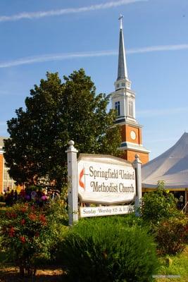 Springfield United Methodist Church, tent from Spring Festival in background.