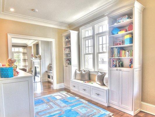 Transitional space between dining room and kitchen.  Space for kids to play and a play to put the toys out of sight.