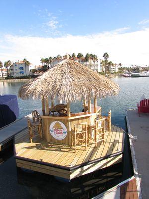 Our tiki bar we had built in 2016 which we use to cruise around the harbor in for dining and to spend time with friends, family and clients.