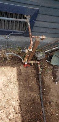 NEW WATER MAIN FROM METER TO HOME WITH QUARTER TURN VALVES AND REGULATOR.