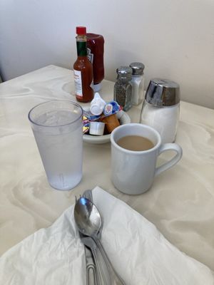 Coffee, and standard table setting with condiments