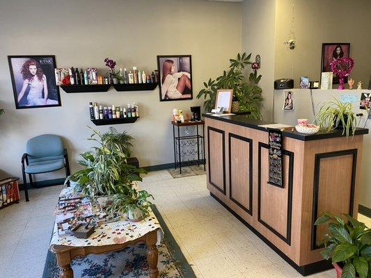 Reception area. Complimentary coffee, tea, and water. Low-key, cozy family friendly salon.