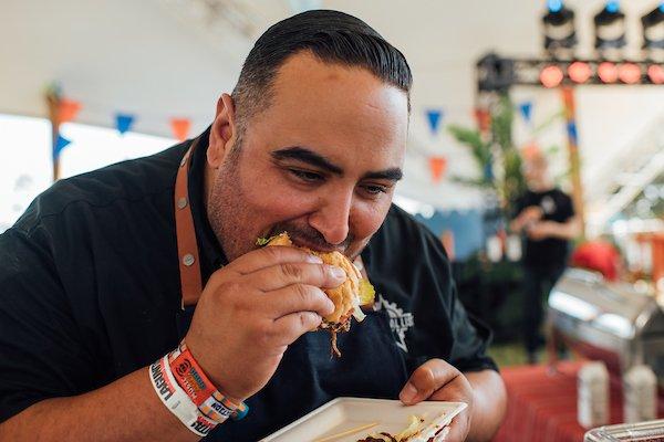 Chef Luis Navarro of Lola's Mexican Cuisine (Long Beach) tries a roast beef poboy from Pop's Poboys (Lafayette, LA).