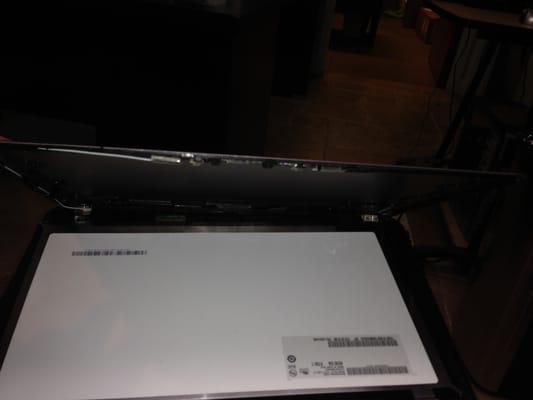 Laptop as returned to me with screen and bezel unattached from top cover.