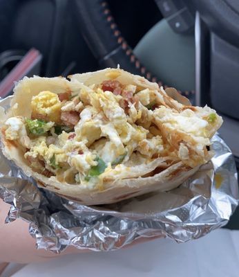 Bacon egg cheese burrito + sour cream & jalapeños