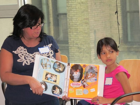 mother and daughter sharing their lifebook