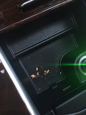 Crushed ice cream sprinkle under the pen in my center console.