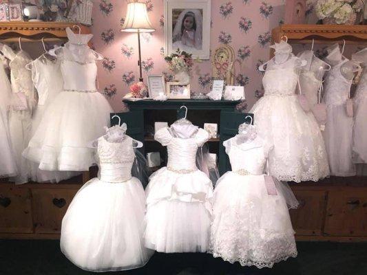 Our exquisite collection of couture Communion dresses & accessories.