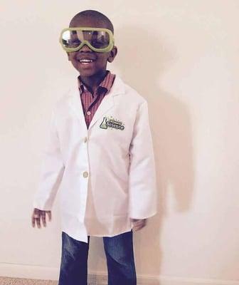 Wearing their lab coat and goggles, students do hands-on activities daily.