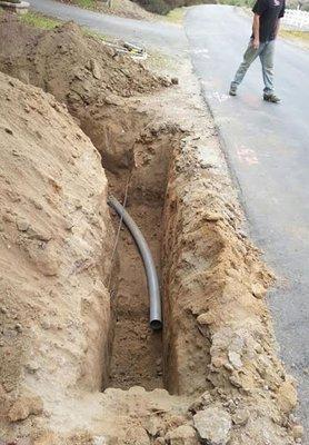 This trench in Temecula, CA has a 90 degree bend with a twelve and a half foot radius. This is required by Edison to reduce the friction.