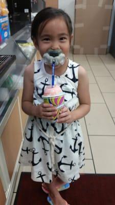 Niece enjoying her slurpee with their $2 animal straw. They have dog, cat, bird, & fox face straws (6/30/15)