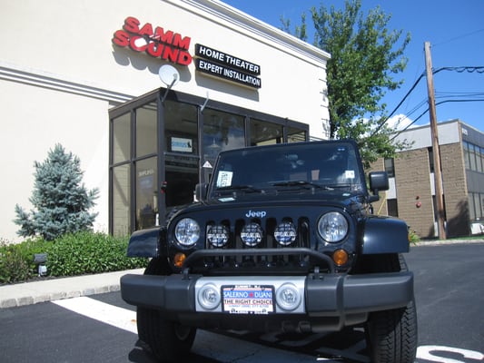 we installed fog and driving lights and a front grill on this Jeep Wrangler