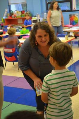 SPS Kindergarten teacher, Michelle Comstock, greets her class with a smile on the first day of school.