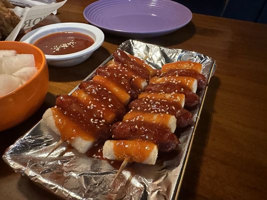 so-ddeok so-ddeok, fried sausage and fried Korean rice cake smothered in hot & sauce gochujang sauce.