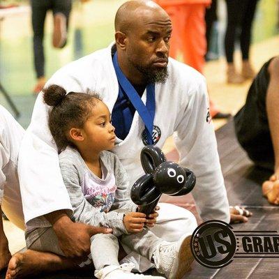 Me and my youngest daughter watching my teammates at US Grappling.