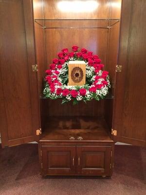 Roses done to surround an urn for a memorial service.