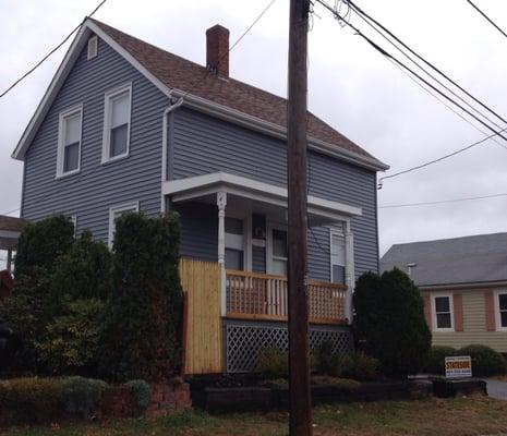 After - new Certainteed Flagstone vinyl siding with white trim