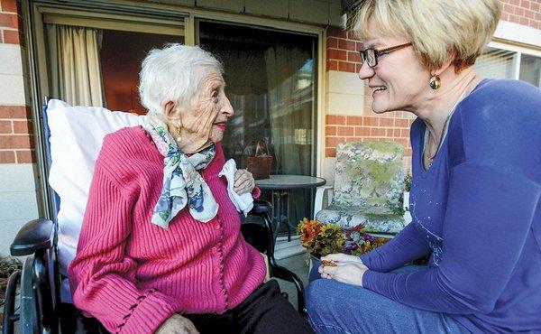 Hospice volunteer with a patient.