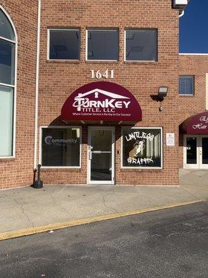 Entrance located on the side of Crofton Woods Shopping Center.