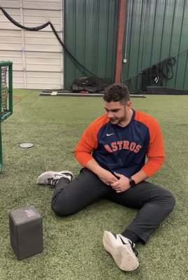 Houston Astro player completing hip mobility