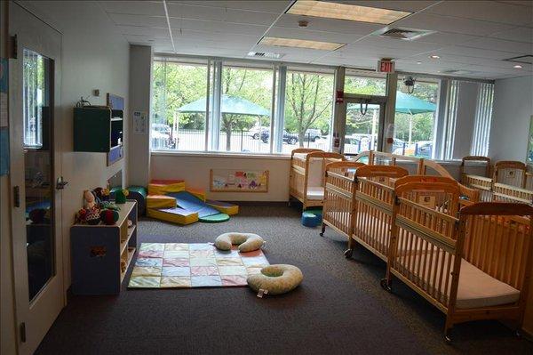 Infant classrooms include toys and materials for babies of all developmental stages to explore.