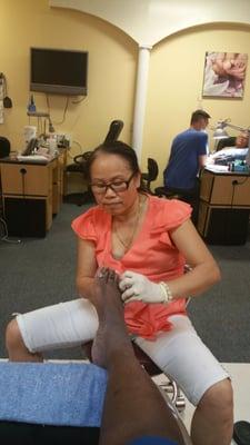 Lisa, working hard on my awful feet. I will follow her anywhere.  Lol!