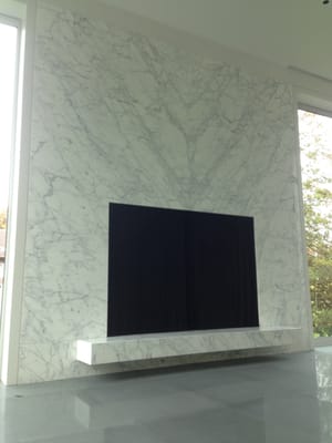 Bookmatched Statuary White marble fireplace by CCS Stone. Residence Bergen County