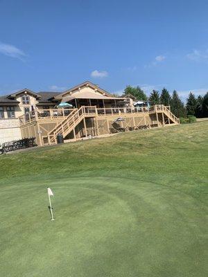 Back of Clubhouse and Practice Putting Green