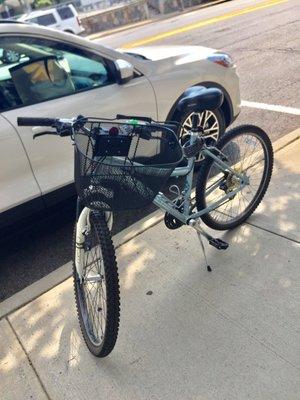 My bike after visiting the shop. They filled my tire, provided an adapter and I purchased this basket which they installed. Love it.