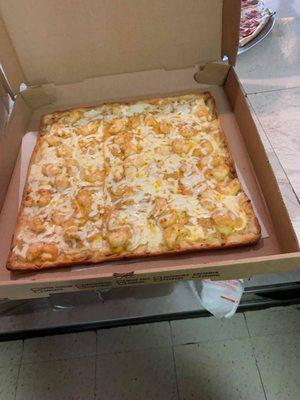 Shrimp scampi on a rectangular thin crust pizza